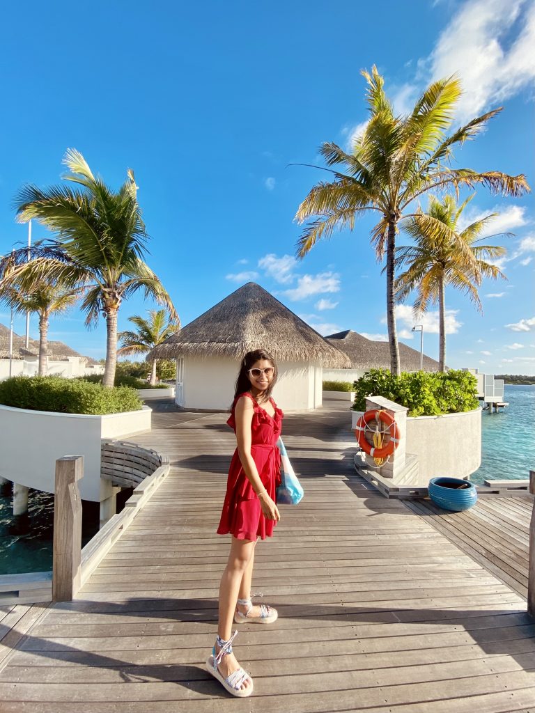 A girl in a red dress in Maldives