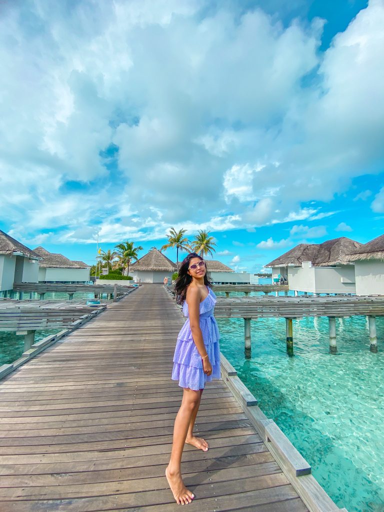 A girl in a beautiful lilac dress in Maldives