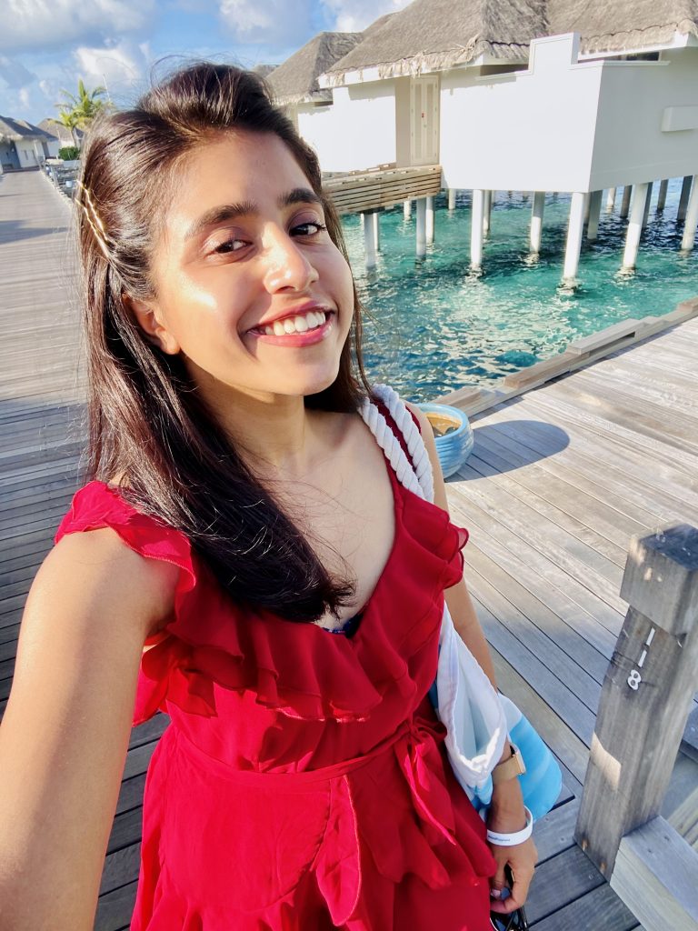 A girl in a red dress in Maldives